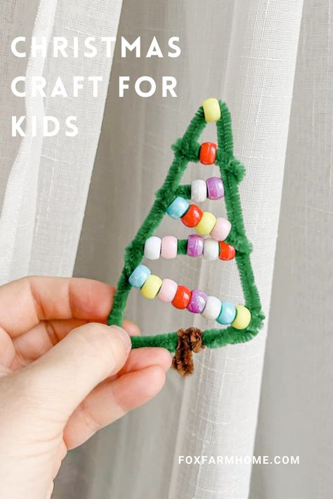 This pipe cleaner Christmas tree ornament is a great craft for kids this holiday season. It is an adorable addition to a Christmas tree and would make a sweet present topper for a personal touch. With 2 simple materials this craft is budget friendly and oh so simple! Two Year Old Christmas Ornament, Easy Pipe Cleaner Crafts For Kids Christmas, Christmas Bead Crafts For Kids, Crafts For Kids Pipe Cleaner, Christmas Tree Pipe Cleaner, Pipe Cleaner Crafts For Kids Christmas, Christmas Pipe Cleaner Crafts, Kids Diy Christmas Ornaments, Diy Ornament Tree