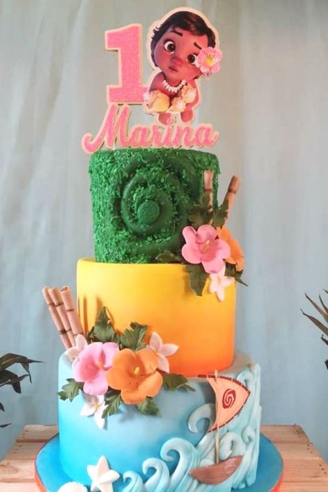 Don't miss this tropical Moana 1st birthday party! Love the birthday cake! See more party ideas and share yours at CatchMyParty.com  #catchmyparty #partyideas #moana #moanaparty #moanacake#luau# girl1stbirthdayparty #moanacake Two Year Old Moana Birthday Party, Moana 3rd Birthday Cake, Moana First Birthday Cake, Moana 2 Birthday Party Ideas, Moana Birthday Shirt, Moana Pool Birthday Party, Baby Moana Birthday Party Decorations, Moana First Birthday Party Ideas, Moana 3rd Birthday Party