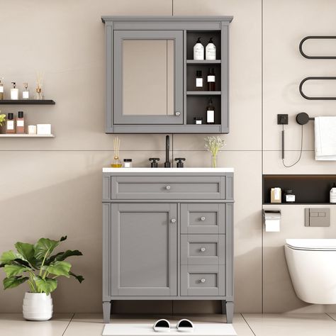 PRICES MAY VARY. Elegant & Modern Design: Our bathroom vanity captures clean lines, crisp geometry and contrasting use of mix material and color. With its classic, traditional style, and spacious storage options, this freestanding vanity is the perfect addition to any bathroom. High-quality Material: Our bathroom vanity with single sink features a solid wood base and a waterproof finish, making the vanity body sturdy and durable, the smooth surface of the ceramic sink and vanity top are easy to Modern Bathroom Storage, Freestanding Bathroom Storage, Mirror Storage, 30 Bathroom Vanity, Bathroom Lamp, Freestanding Vanity, Bathroom Necessities, Vanity Set With Mirror, Bathroom Mirror Cabinet