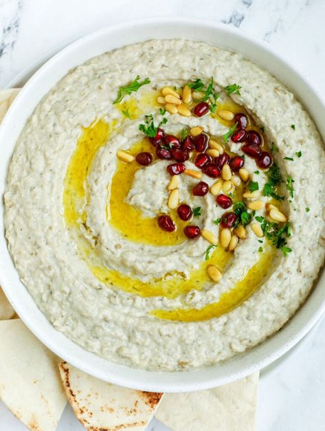 baba ghanouj in a plate topped with olive oil, toasted pine nuts and pomegranate seeds Lebanese Hummus Recipe, Baba Ganoush Recipe, Lebanese Lentil Soup, Babaganoush Recipe, Vegetable Dips, Honey Bbq Chicken, Eggplant Dip, Lebanese Food, Baba Ganoush