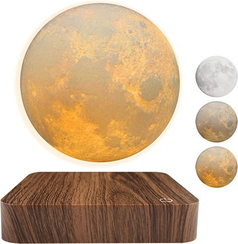 Illuminate your office space in a way that's out of this world with our Levitating Moon Lamp. This magnetic floating masterpiece offers a unique, eye-catching design and three stunning color modes to set the perfect ambiance. Experience the mesmerizing spin and enchanting glow that will elevate your home décor to new heights. Don't miss out on this captivating conversation starter – Follow us for more! Levitating Moon Lamp, Moon Light Lamp, Moon Night Light, Holiday Room Decor, Tech Gadgets Gifts, Bedroom Unique, Desk Lamps Bedroom, Holiday Room, Lamp 3d