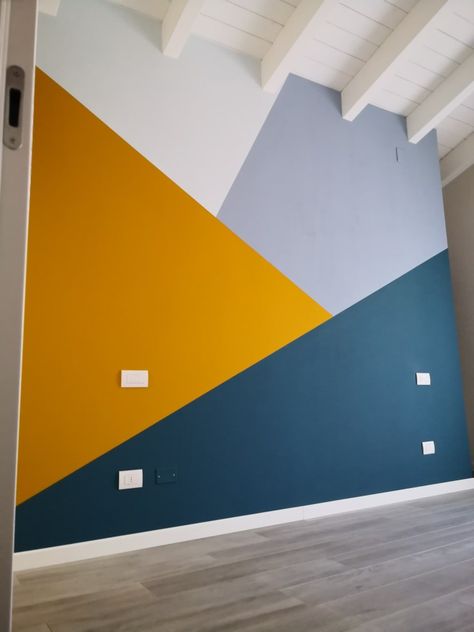 Painted Geometric Wall, Geometric Wall Design Ideas, Blue And Yellow Wall Paint Ideas, How To Paint Geometric Patterns On Wall, Graphic Wall Painting Ideas, Multi Color Wall Paint Ideas, Painted Shapes On Wall, Diagonal Painted Wall, Triangle Wall Design