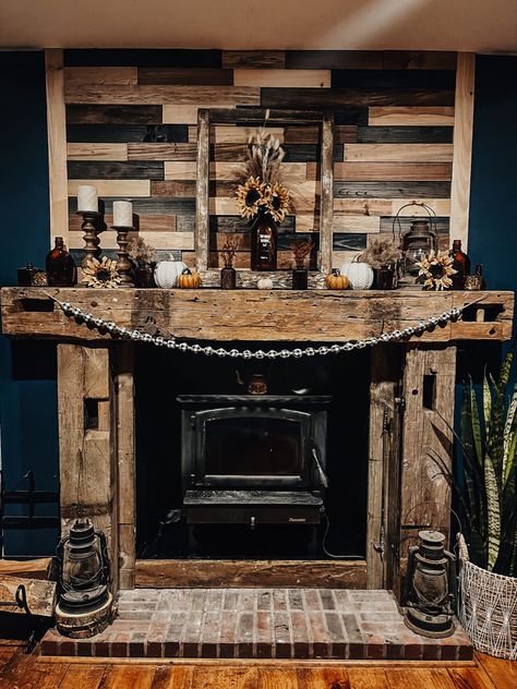 3D wood stained reclaimed wood with barn wood beams.  Fall Decor.  Farmhouse mantle Fireplace Mantle Decor Western, Pallet Stove Ideas, Rustic Wood Fireplace Surround, Small Fake Fireplace Ideas, Cabin Mantle Decor Rustic, Reclaimed Wood Fireplace Surround, Western Fireplace Decor, Rustic Wood Stove Surround, Western Mantle Decor