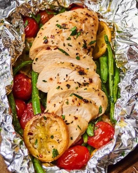 10 Best Foil Packet Chicken Recipes | Kitchn Foil Packet Chicken, Foil Chicken, Lemon Garlic Chicken Breast, Foil Recipes, Chicken Packets, Foil Packet Potatoes, Chicken Foil Packets, Foil Packet Dinners, Freezer Dinners