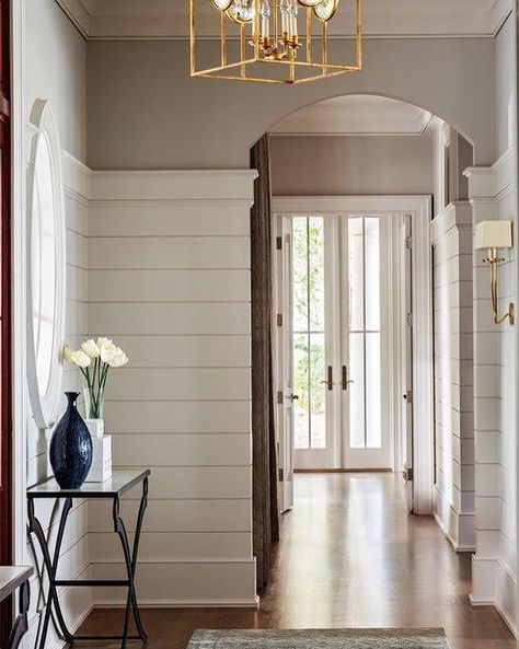 McDonald Architects on Instagram: “Simple touches—shiplap walls and a curved doorway—amplify this entryway. French doors at the end of the hall brighten the space and add…” Lowcountry Style Home, Low Country Lighting Fixtures, Low Country Interiors, Low Country Homes Interior, Low Country Interior Design, Low Country Cottage, Judges Paneling, Shingle Style Architecture, Low Country Homes