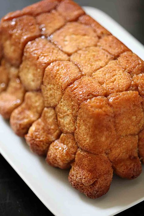 A gooey, sweet, classic cake made from pull-apart blobs of brioche dough coated in a buttery, cinnamony caramel sauce. Easy as can be to make. And fun as heck to eat. #monkeybread #baking #breadrecipes #caramel #kids Bread Brioche, Breakfast Carbs, Bread Artisan, Brioche Dough, Recipes Written, Brioche Recipe, Yeast Dough, Pure Evil, Yeast Breads