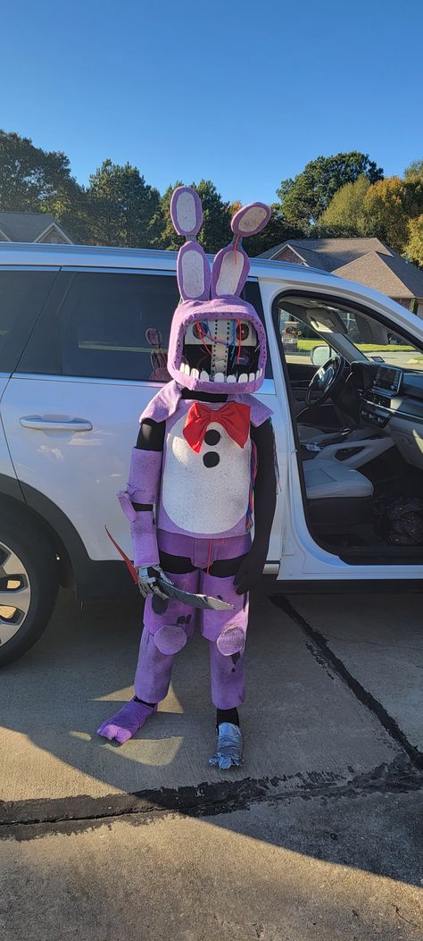 Cardboard, purple fabric, yarn, A LOT of hot glue and duct tape Withered Bonnie Costume, Spring Bonnie Costume, Withered Bonnie Costume Diy, Fnaf Cardboard, Cosplay With Cardboard, Fnaf Bonnie Cosplay, Five Nights At Freddy’s Costume Diy, Five Nights At Freddy’s Cosplay, Bonnie Costume