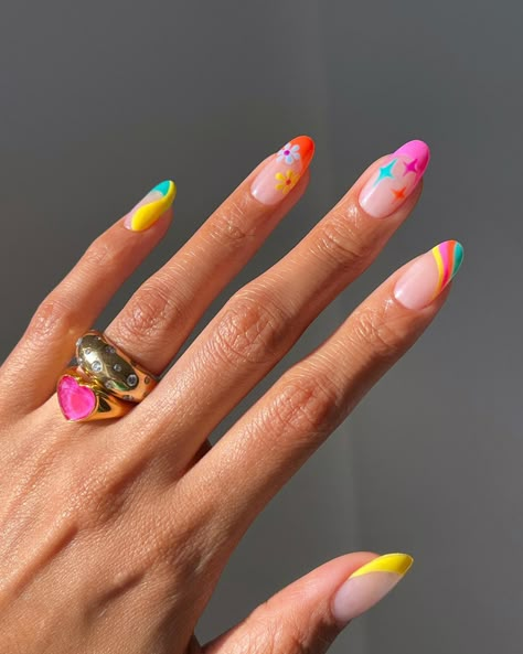 Summer is here, so it's only time to dive into our top summer nail trends of 2024. We've got all the inspo for your clients that will create the perfect accessory to complete every summer look. We’ve curated the hottest summer nail trends that will keep your client's nails looking vibrant and fresh. Let’s dive into the season’s fabulous styles. Neon Pop Art Nails, Colourful Nail Tips, Colorful Summer Nails 2024, Neon Nails 2024, Simple Neon Nails, Summer Nail Designs 2024, Neon Nails Ideas, Festival Nail Ideas, Holiday Manicure Ideas