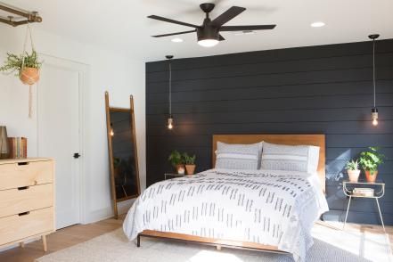 In one of their biggest stylistic challenges yet, our fearless Fixer Upper duo has a tall order to fill when a couple moving from Denver wants a country retreat — but a house with thoroughly modern vibe. See what happens when Joanna gives up shiplap (well, mostly) in favor of lots steel and concrete. Black Accent Walls, Shiplap Accent Wall, Dekorasi Kamar Tidur, Accent Wall Bedroom, Couple Bedroom, Dreamy Bedrooms, Ship Lap Walls, Black Walls, Fixer Upper