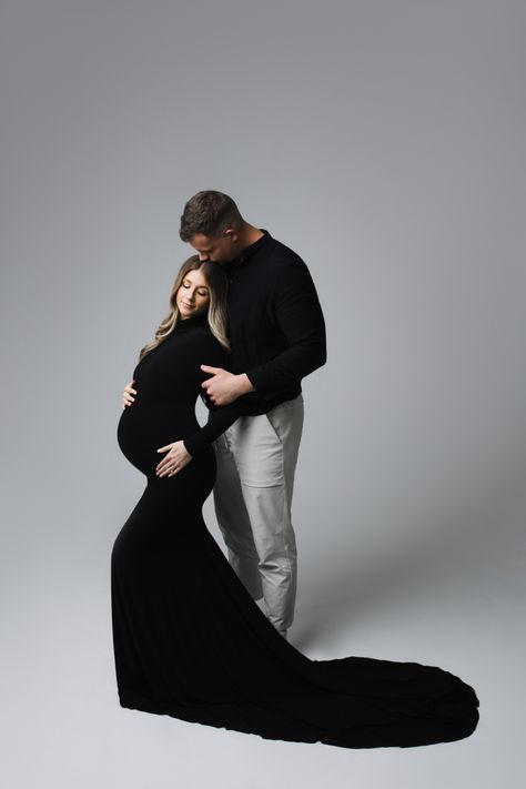 Maternity Studio Photoshoot Couple Poses, Classy Maternity Photos, Formal Maternity Shoot, Family Of 3 Maternity Pictures Studio, High End Maternity Shoot, Winter Studio Maternity Photoshoot, Elegant Maternity Shoot With Family, Maternity Photo Shoot Black Dress, Classy Pregnancy Photoshoot