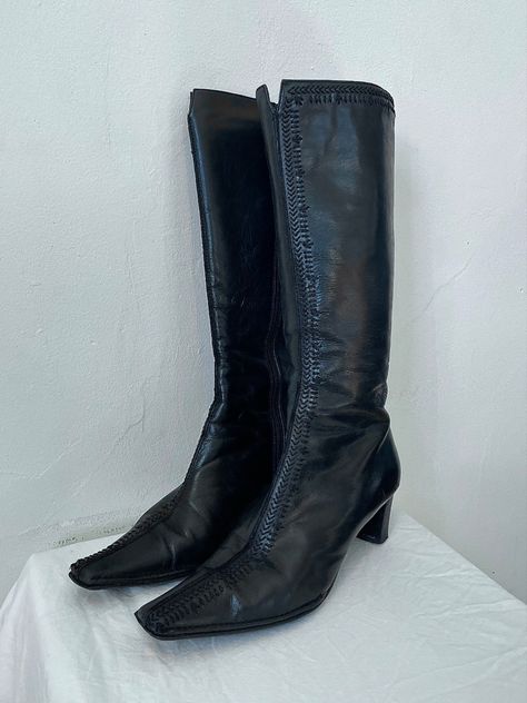 Incredible vintage Valeria Grossi authentic leather black knee high boots. Feature hand stitched detail don’t the front seam and edging. Mid heel. Zip closure. Tapered square toe. SIZE 38. 100% Leather. 

Available on Depop @cinnvintage

#modeloffduty #depop #depopseller #y2k #minimalist #fashion #style #oneofakind #vintage #vintagestore #bellahadid #kendalljenner #preloved #styleinspo #whimsygoth #europeansummer #leatherboots #vintageboots #kneehighboots #pointyboots #witchboots Black Pointy Boots, Leather Black Knee High Boots, Vintage Black Boots, Wide Shaft Boots, 90s Boots, Y2k Boots, Long Black Boots, Pointy Boots, Y2k Minimalist