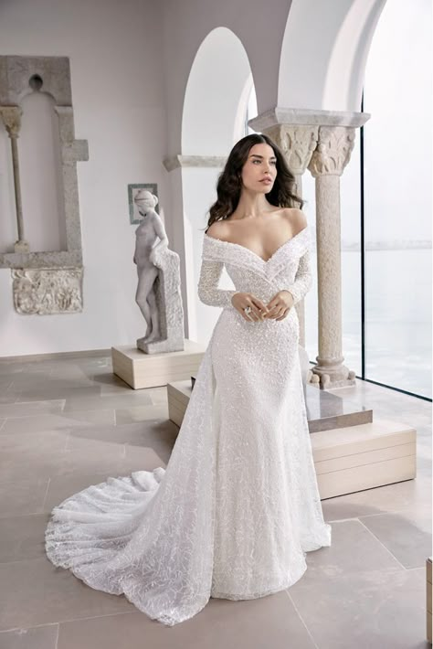 The Wedding Dress Designs That Every Bride Needs To See Off The Shoulder Fit And Flare Wedding Dress, Long Sleeve Wedding Dress Fit And Flare, Fit And Flare Wedding Dress Off Shoulder, Ronald Joyce Wedding Dress, Tight Wedding Dress With Sleeves, Off The Shoulder Sheath Wedding Dress, Wedding Dress Removable Sleeves, Mermaid Wedding Dress With Sleeves, Sequin Wedding Dress