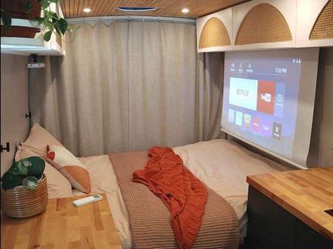 The couple even built a hidden projector screen in their van for entertainment. - Courtesy of Deanna Dunn Projector In Camper, Camper Projector Screen, Projector In Van, Campervan Projector, Van Life Projector, Van Life With Two Beds, Double Bed Camper Van, Ram Promaster, Sprinter Camper