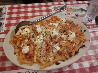 Cooked and drain Ziti. Mix Alfredo and marinara sauce together. (Reserve 1/4 cup of the alfredo-marinara sauce mixture.)Stir in Shredded cheese mixture. Gently toss ziti with the cheese-sauce mixture.Combine Ricotta, Parmesan and pepper in a small mixing bowl.  In a pan,spread the 1/4 cup reserved sauce evenly on bottom of pan.  Dot top of pasta with Ricotta mixture.  Sprinkle bread crumb mixture evenly over top of pasta.  Bake at 350 degrees for 12-15 minutes until top becomes golden brown. Marinara Sauce Recipe, Baked Ziti Recipe, Birthday Freebies, Copycat Restaurant Recipes, Baked Ziti, Stuffed Pasta Shells, Birthday Food, Restaurant Recipes, Copycat Recipes