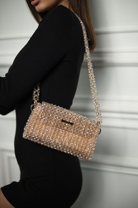 Crystal beaded bags are popular choices for formal occasions, evening events, or any time when a touch of glamour is desired. They can add a statement-making element to an outfit and are often chosen to complement elegant dresses or evening gowns. The beaded texture of the bag not only adds visual interest but also provides a tactile and luxurious feel. Whether you're treating yourself or searching for the perfect gift for a fashion-forward friend, this crystal beaded bag is sure to impress. Ele Sparkle Purse, Sparkly Bag, Charm Bracelets For Girls, Gold Handbag, Hand Beaded Bag, Crystal Handbag, Beaded Clutch Bag, Glitter Bag, Diy Leather Bag