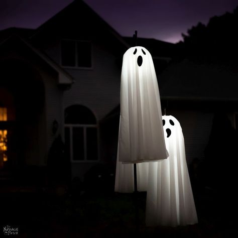 DIY Lighted Hanging Ghosts Diy Outdoor Light Up Ghost, Glowing Ghosts Diy, Diy Ghost Hanging From Tree, Diy Chickenwire Ghost, Diy Hanging Light Up Ghosts, Halloween Solar Lights, Dollar Store Halloween Diy, Solar Mason Jars, Diy Outdoor Lighting