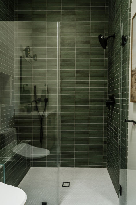 Stacked horizontal green shower tile with black accents in moody bathroom. #thedendesigngroup #moodybathroom #teenboysbathroom #blackplumbing #blackshowerfixture #bayareainteriordesign Bathroom Horizontal Tile, Moody Green Tile Bathroom, Dark Bathroom Shower Tile, Dark Green Shower Tile, Green Bathroom Tile, Shower Tile Patterns, Black Shower Fixtures, Green Shower Tile, Midcentury Modern Bathroom