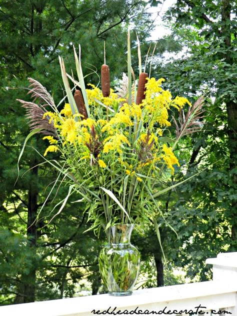 Cattail/Goldenrod Centerpiece. (may have to use artificial cattails , as it is illegal to disturb wetlands [at least in Michigan] therefore picking cattails). Cat Tail Bouquet, Cat Tail Decorations, Cat Tails Wedding Decor, Cat Tail Centerpieces, Flower Arrangements With Cattails, Cat Tail Wedding Decor, Arrangements With Cattails, Cat Tail Arrangements, Cat Tail Floral Arrangements