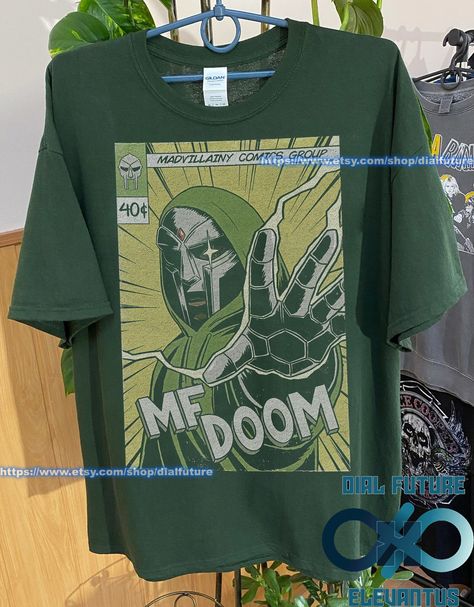 Green Shirt Design, Mf Doom Comic, Mf Doom Merch, Doom Comic, Mf Doom Shirt, Mf Doom T Shirt, Fire Clothes, Hip Kids, Hip Hop Shirts