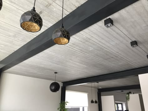 Metal beams and concrete. A combination I will always love. Concrete Beams Ceiling, Charcoal Beams Ceiling, White Ceiling Black Beams, Flip Kitchen, Loft Style Living Room, Metal Pole Barns, Wood Plank Ceiling, Timber Truss, Grey Wood Floors