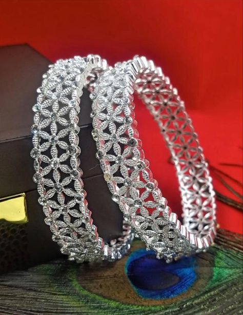 White stone studded silver Kada bangles. Base Metal: Alloy Plating: Silver Plated Stone Type: Cubic Zirconia/American Diamond Sizing: Non-Adjustable Type: Kada Net Quantity (N): 2 Sizes:2.4, 2.6, 2.8 Price: 285 Silver Kangan, White Stone Bangles, Bangles Set Indian, Kangan Design, Bangles Collection, All Status, Stone Bangles, Indian Bangles, Designer Bracelet