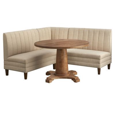 The Cariana 4 piece banquette dining set creates a cozy space for dining or relaxing with a cup of coffee. Perfect for the corner of a dining room or breakfast nook, this set includes a beautiful pedestal table and comfy L-shaped seating consisting of a corner chair with two benches. Seats are generously cushioned and upholstered in a crema linen-like fabric with vertical pinstripes on the seat-backs. Legs are made from solid rubberwood and finished in walnut, giving the set a slightly midcentur Built In Seating Kitchen, Kitchen Dining Nook, Nook Dining, Banquette Dining, Breakfast Nook Dining Set, Upholstered Banquette, Couch Seats, Nook Dining Set, Nook Table