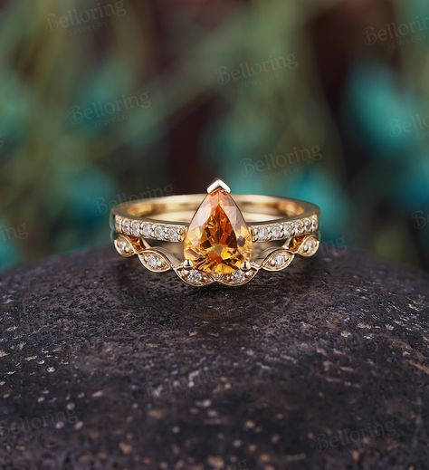 Pear shaped Imperial Topaz Diamond engagement ring set, Vintage yellow gold moissanite/diamond unique ring, art deco anniversary bridal set --------------------Specifications---------------------- Engagement ring Center Stone - 6*8mm Imperial Topaz Side stones - about 0.09ct Moissanite or Diamond Diamond Clarity - SI Diamond Color - H-G Wedding band Stones - about 0.09ct Moissanite or Diamond Diamond Clarity - SI Diamond Color - H-G ---------------------DIMENSIONS---------------------- Engagemen Canary Diamond Engagement Ring, Pave Wedding Band, Citrine Engagement Ring, Citrine Ring Engagement, Pave Wedding Bands, Promise Ring Set, Citrine Jewelry, Imperial Topaz, Bridal Ring Sets