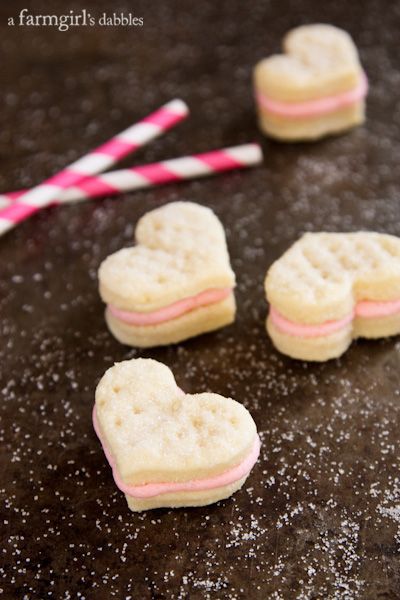 Cream Wafer Sandwich Cookies with Strawberry Buttercream - afarmgirlsdabbles.com Wafer Sandwich Cookies, Cream Wafers, Cookie Cookbook, Strawberry Buttercream, Shaped Cookies, Heart Shaped Cookies, Wafer Cookies, Buttery Cookies, Buttercream Recipe