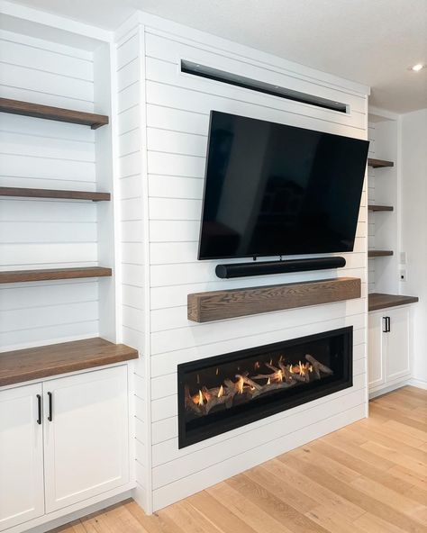 media wall with fireplace • Instagram Media Wall With Fireplace And Tv Shiplap, Built Out Tv Wall, Fireplace With Cupboards Either Side, Entertainment Unit With Fireplace, Built In Shelves Living Room With Electric Fireplace, Built In With Tv And Fireplace, Built In Shelves With Electric Fireplace, Small Living Room With Fireplace And Windows, Diy Media Wall With Fireplace