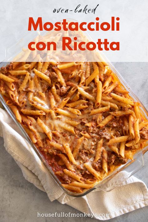 Photo of a baking dish that contains baked mostaccioli pasta with tomato sauce and Italian sausage. Mostaccioli Recipe With Ricotta, Cheesy Mostaccioli Recipe, Crockpot Mostaccioli Recipe, Baked Mostaccioli Recipe, Mostaccioli Recipe, Baked Mostaccioli, Dum Dums, Ziti Pasta, Ricotta Recipes