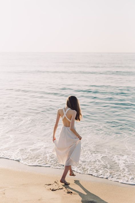 A Woman in White Dress Walking on the Beach · Free Stock Photo White Beach Dress Summer, Beach Dress Photoshoot, Beach White Dress, Beach Illustration, Beach Wallpaper, Beach Poses, Cute Poses For Pictures, Beach Photoshoot, Destin Beach