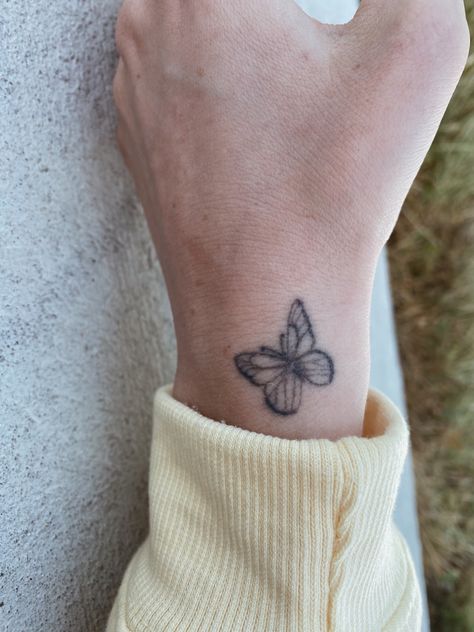 Simple butterfly tattoo on hand, basic idea and design, location idea, hand tattoo, butterfly tattoos, basic butterfly. Butterfly Tattoo Hand Wrist, Small Wrist Butterfly Tattoos, Small Butterflies Tattoo On Wrist, Mini Butterfly Tattoo Wrist, Dainty Butterfly Tattoo Wrist, Simple Butterfly Tattoo, Butterfly Hand Tattoo, Small Butterfly Tattoo, Healing Tattoo