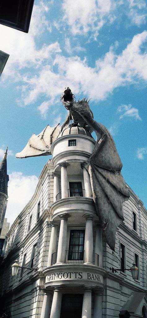 •the Gringotts Bank with the dragon at Universal Studios• Diagon Alley Aesthetic Wallpaper, Harry Potter Wallpaper Ios 16, Gringotts Bank Aesthetic, Alley Diorama, Harry Potter Gringotts Bank, Gringotts Dragon, Gringotts Bank, Deathly Hallows Part 2, Instagram Graphic Design