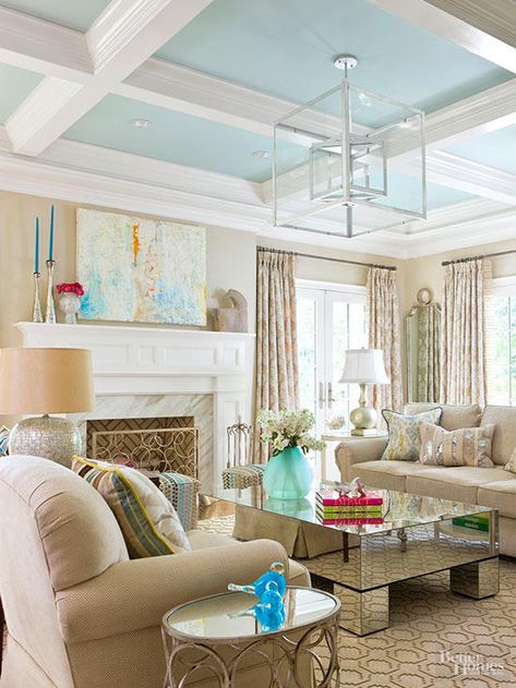 Soft aquamarine paint handily highlights this ceiling's white-painted beams while also softening their boxy silhouettes. The watery hue perfectly suits this living room's beach-inspired scheme. The breezy blue repeats in varying shades as pillow and ottoman fabrics, accessories, and artwork. Ceiling Paint Colors, Blue Ceilings, Room Aesthetics, Paris Grey, Colored Ceiling, Interior Painting, White Rooms, Painted Ceiling, Shabby Chic Homes