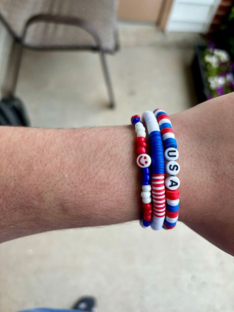 Celebrate your patriotic spirit with our exclusive collection of handmade bracelets set! Perfect for the 4th of July, Memorial Day, or any day you want to show off your love for the USA, these bracelets are designed with vibrant red, white, and blue beads. Each bracelet is crafted with care and attention to detail, ensuring a high-quality accessory you'll love to wear. Check out these amazing patriotic bracelets: - Stand out with our striking Red, White, and Blue Clay Bead Bracelet featuring bold USA lettering. - Spread some cheer with our Red, White, and Blue glass bead bracelet adorned with a red smiley face. bead bracelet: Add a touch of fun to your patriotic ensemble with this cheerful red smiley face on a red, white, and blue bracelet. - Embrace the spirit of the American flag with ou Red Smiley Face, 4th Of July Gifts, Blue Bracelets, Clay Bead Bracelets, Patriotic Bracelet, Clay Bead Bracelet, Blue Clay, Glass Bead Bracelet, Clay Bracelet