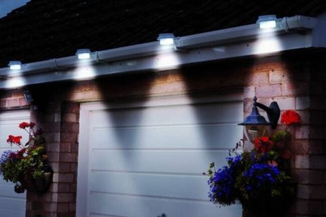 The Best Solar Gutter Lights For a Brighter Outdoor Space | Bob Vila Up House, Outdoor Solar, Raised Beds, Landscape Lighting, Garage Door, Solar Powered, Outdoor Projects, Garden Lighting, Solar Lights