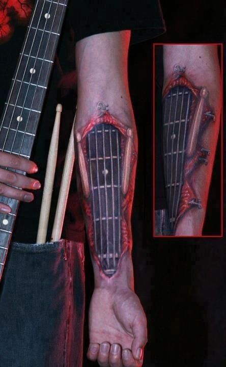 Guitar tattoo, guitar neck, strings, frets, forearm, rock and roll, metal, punk, music, hardcore, band, sick www.rockthefout.com Punk Rock Tattoos, Tattoo Guitar, Drum Tattoo, Best 3d Tattoos, Guitar Tattoo Design, Rock Tattoo, Tattoo Trend, Sick Tattoo, Guitar Tattoo