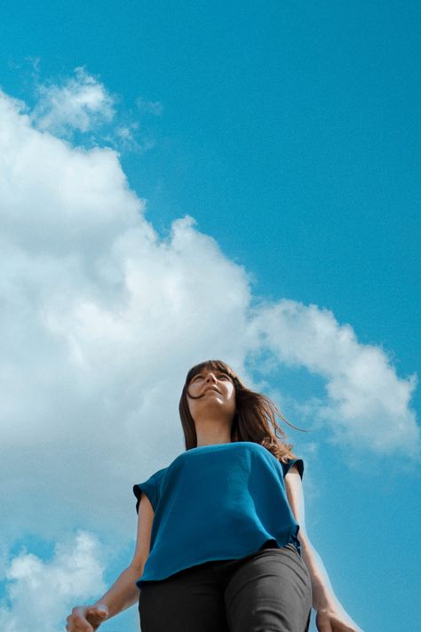 Sky photoshoot and low angle portrait, shot against a blue cloudy sky backdrop. Blue sky portrait of musician and female guitarist Camilla Overgaard. Here's some retro blue colors and cool sky background aesthetics. Portrait by Ther Artist Portraits Blue Sky Portrait, Blue Sky Photography, Outdoor Portrait Photography, Musician Portraits, Vinyl Style, Female Guitarist, Sky Photos, Outdoor Portraits, Professional Portrait