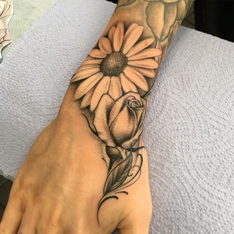 Flower daisy rose Daisy Flower Tattoos Men, Daisy Hand Tattoos For Women, Men’s Daisy Tattoo, Sunflower Rose Daisy Tattoo, Daisy And A Rose Tattoo, Big Daisy Tattoo, Daisy Hand Tattoo, Daisy Tattoo Men, Rose And Daisy Tattoo