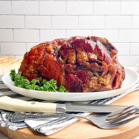 Ham in a Roaster is tender and juicy with a sweet, savory pineapple brown sugar glaze. Delicious, easy holiday ham recipe. Ham In A Roaster, Pineapple Brown Sugar Glaze, Chicken Cranberry Salad, Chocolate Caramel Poke Cake, Cook A Ham, Red Skin Mashed Potatoes, Roaster Recipes, Chicken Cranberry, Holiday Ham Recipes