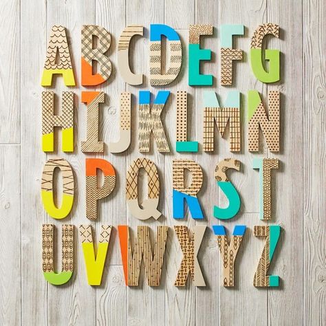 Creative paint-dipped letters from The Land of Nod Wooden Letters Diy, Painted Wood Letters, Wooden Letters Decorated, Paint Dipping, Painting Wooden Letters, Unique Stamps, Wooden Alphabet, Diy Letters, Land Of Nod