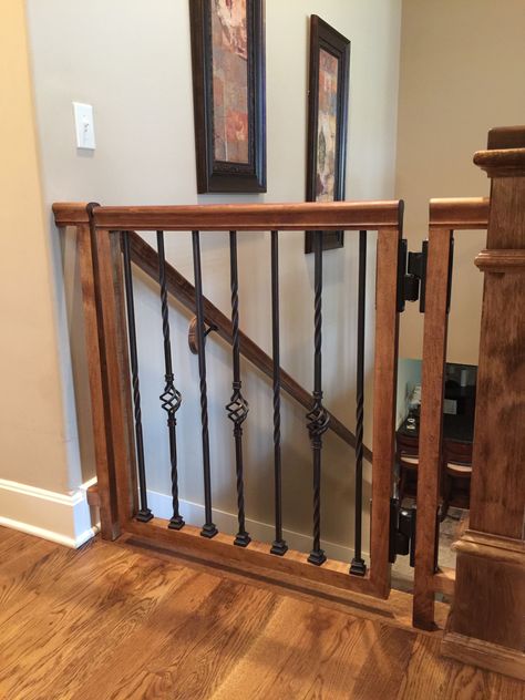 Custom dog gate built to match our existing stair railing.  Made from 2x2 maple, 211 Provincial stain, Boerboel 180 hinges and iron balusters. Custom Stair Gate, Custom Dog Gates, Gate Stairs, Staircase Gate, Custom Baby Gates, Dog Gates For Stairs, Diy Dog Gate, Baby Gate For Stairs, Diy Baby Gate