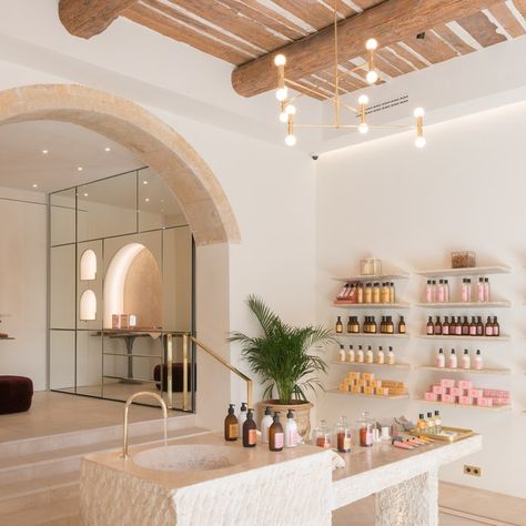 BASTIDE new Flagship - The long beloved Aix-en-Provence beauty brand has received a chic update since von Wulffen and Fekkai purchased it two years ago, and now boasts a new home. The flagship was designed by award-winning French architect Amelia Tavella and constructed by local artisans to evoke a bastide, the typical country manor that the company is named for. It features sandstone arches and a centerpiece lavoir carved out of a single block of stone. The potions and lotions, which are made f Deco Spa, Nail Salon Interior Design, Nail Salon Interior, Spa Interior Design, Interior Boho, Hair Salon Interior, Nail Salon Design, Spa Interior, Beauty Salon Design