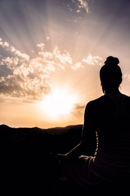 Woman during meditation with the sunset | Premium Photo #Freepik #photo #yoga-nature #yoga-meditation #yoga #meditation Photo Woman, The Sunset, Premium Photo, Free Photo, Meditation, Stock Photos