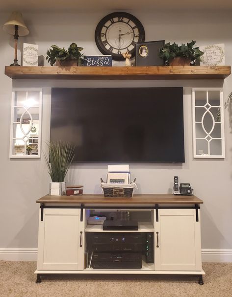 Western Tv Wall Ideas, Decorating Top Of Entertainment Center Farmhouse, Living Room Revamp, How To Decorate A Entertainment Center, Decorate Tv Stand Living Rooms, Wall Decor By Tv On Wall, Summer Tv Stand Decor, How To Decorate Around Mounted Tv, Ways To Decorate Around Mounted Tv