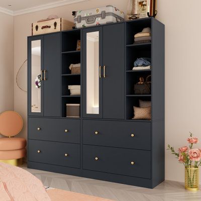 This armoire is the ultimate storage solution for your bedroom. Crafted from solid and engineered wood, it features a paneled door design that opens to reveal ample storage. With four doors, eight shelves, and four exterior drawers, it provides plenty of space for your clothing and accessories. The built-in mirror offers a convenient spot for dressing, making it a practical addition to your bedroom or entryway. Plus, the removable clothing rods allow for flexible storage options. Keep your space Armoire With Mirror, Armoires & Wardrobes, Bedroom Armoire, Dream Rooms, Storage Solution, Door Design, Clothing And Accessories, Ebern Designs, Engineered Wood