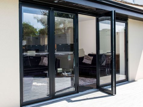 Bi-fold doors are as popular as ever with homeowners looking to introduce more light and bring a sense of the outdoors into their home. But how do you know if aluminium is the right material for you? Metal Entrance Doors, Brown Interior Doors, Sliding Garage Doors, Aluminium French Doors, Folding Patio Doors, House Renovation Projects, Sliding Folding Doors, Double Glass Doors, Window Glazing