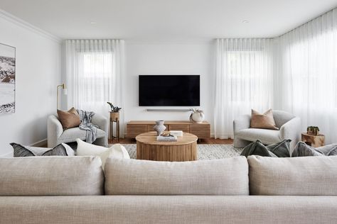 modern coastal living room mounted tv white sheer curtains light grey sofa and boucle armchairs Sheers Curtains Living Room, Modern Coastal Living Room, Light Gray Sofas, Grey Sofa, White Sheer Curtains, Cottage Charm, Cute Cottage, Home Makeover, Curtains Living