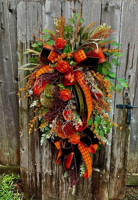 X-Large Fall Wreath Elegant Fall Wreath Fall Wreath Autumn Decor Fall Decor Velvet Pumpkins Designer Ribbons (L)49.  (W) 28 Designed on an Evergreen Swag Base and Deco Mesh added for Fullness and Color this Fall Swag is so Elegant with its antique Orange Jewels a Stunning Bow made with Designer Ribbons. There is a 4' Orange with Glitter Edges, a Deep Rich Chocolate Brown Velvet, an Orange Harlequin pattern  and a Green Velvet. There are Sprays of Burgundy Berries. Large Velvet Pumpkins, Fall Florals, Fall Picks and Mounds of Lush Greenery. This Fall Swag is X-Large and Will be a Fabulous Addition to Any Fall Decor. Ready to Ship Thanksgiving Wreaths For Front Door, Fall Christmas Tree, Evergreen Swag, Elegant Fall Wreaths, Fall Mesh Wreaths, Fall Thanksgiving Wreaths, Fall Decor Diy Crafts, Fall Swags, Fall Grapevine Wreaths