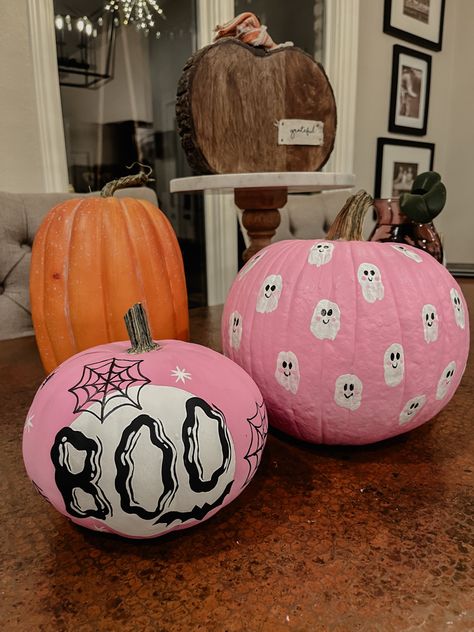 Pink painted pumpkin with mini ghost, spider webs, and bats Cute Punkin Painting Ideas, Carved And Painted Pumpkins, Pink Ghost Painted Pumpkin, Simple Halloween Pumpkin Painting, Halloweentown Pumpkin Painting, 3 Pumpkin Painting Ideas, Mini Punkin Paintings, Halloween Punkin Ideas, Paint Punkin Ideas Easy